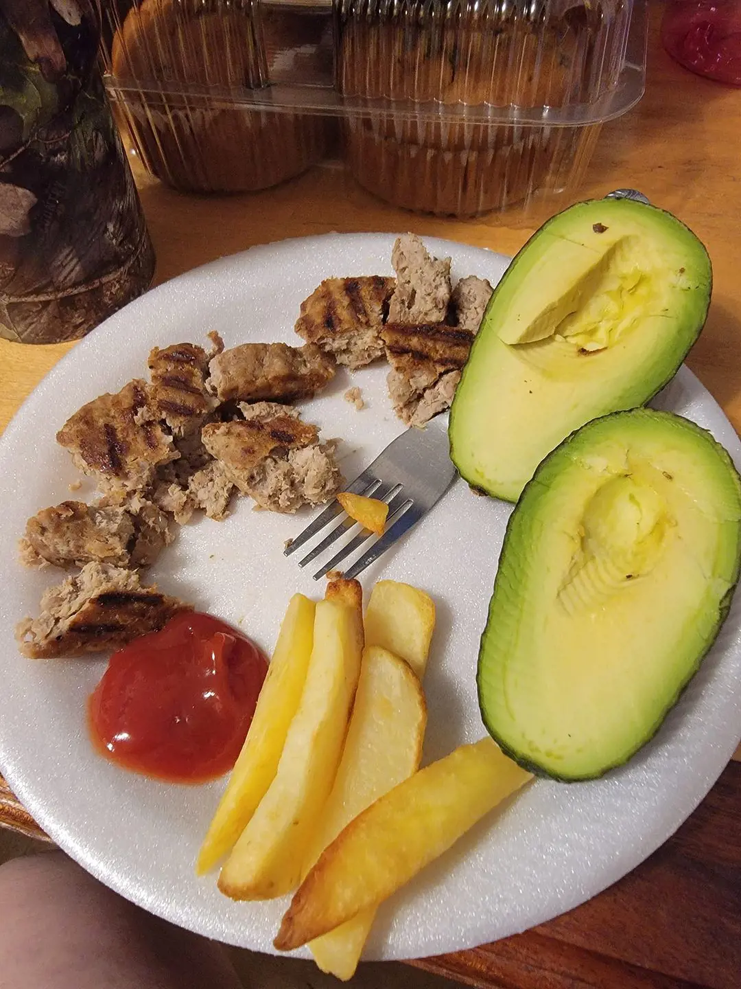 Avocado served with turkey, ketchup, and fries