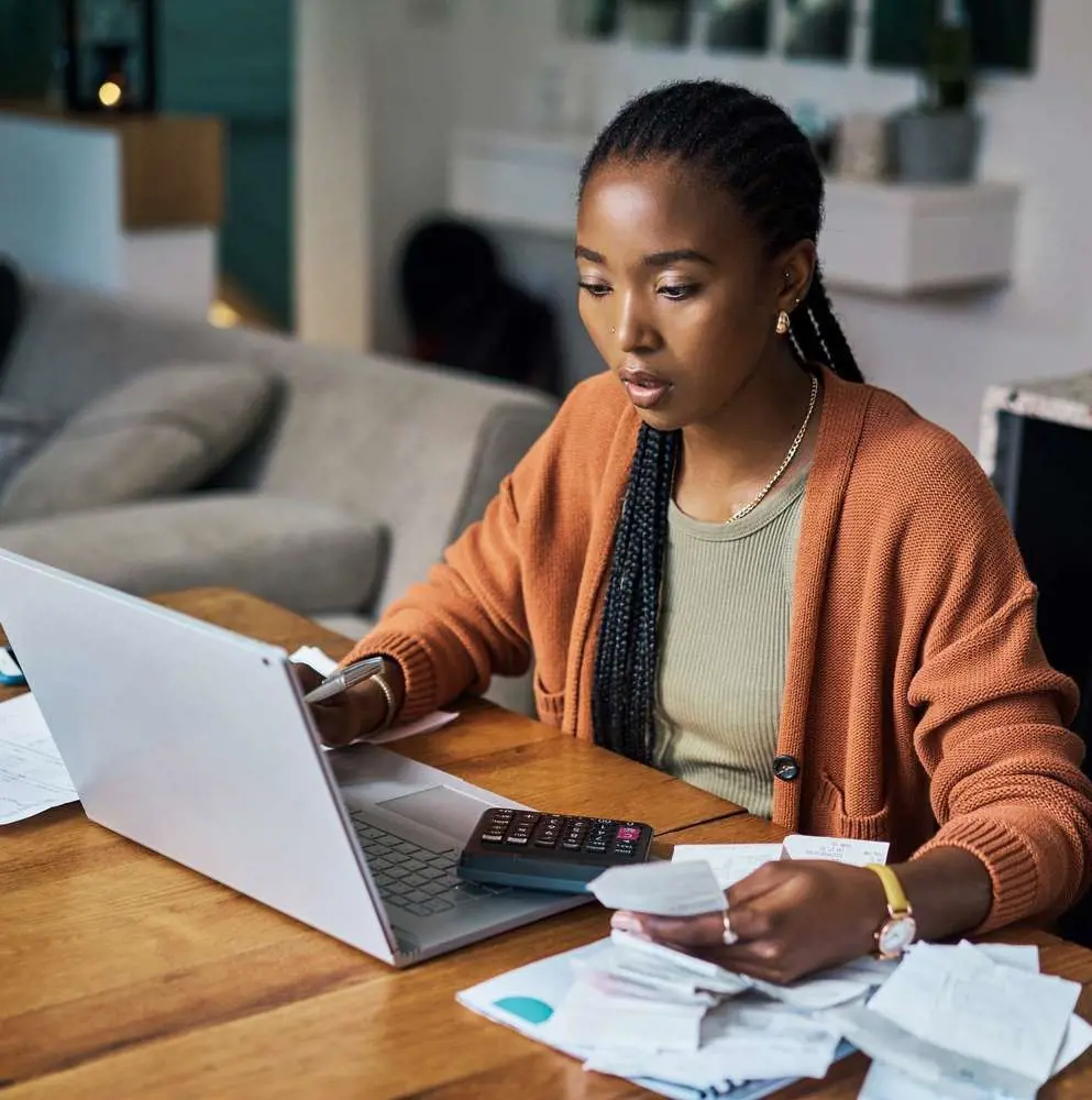 Member of Generation Z calculating her finances